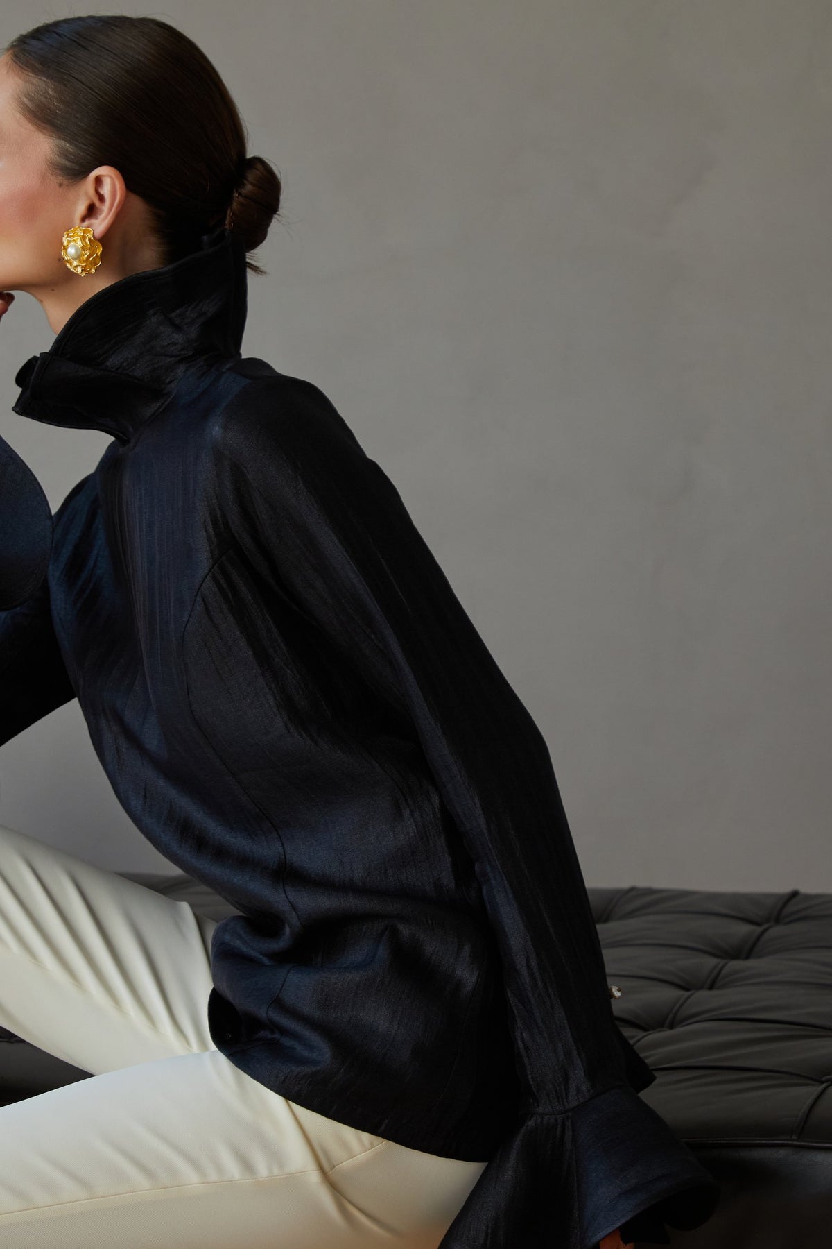Veena Chauhan Fall 2026, black high collar blouse and ivory trousers